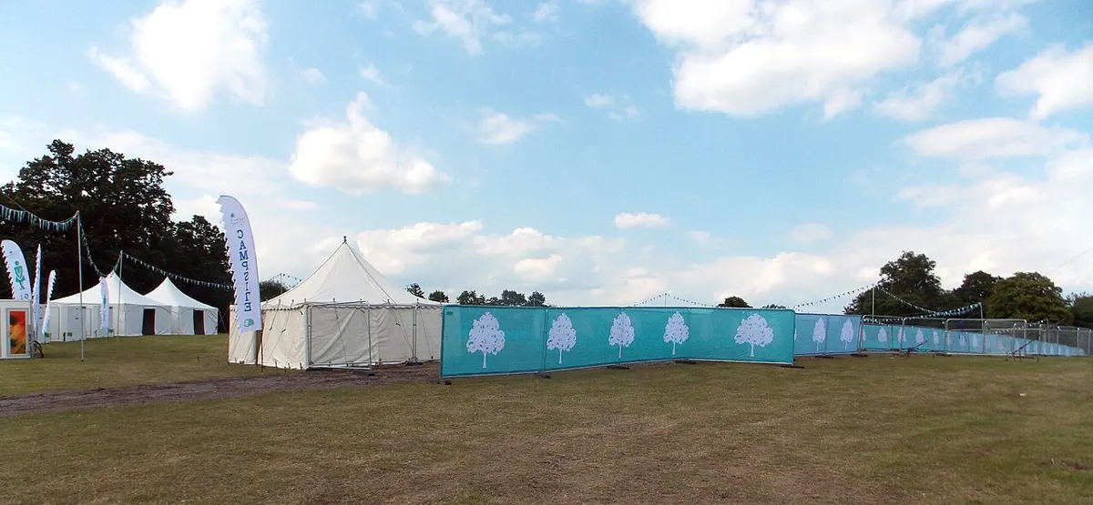 Temporary mesh fencing and screening around an outdoor event in England
