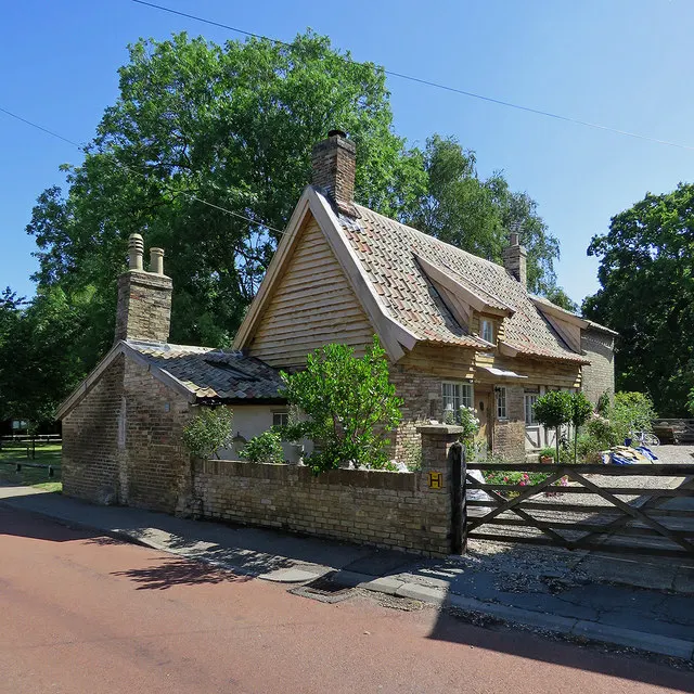 Tiled roof and brick chimneys on an English cottage